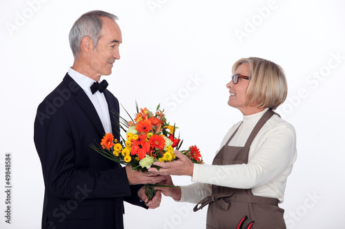 Man buying flowers © auremar