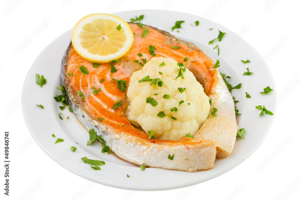 salmon with cauliflower on the plate on white background
