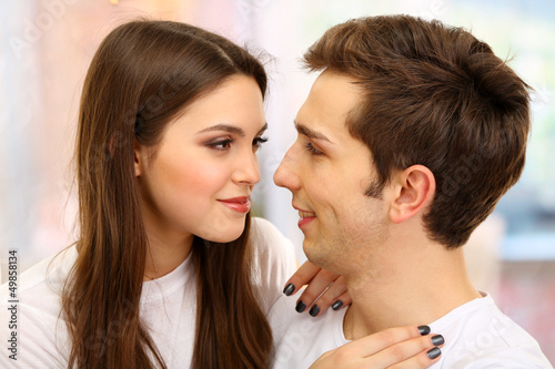 Young couple on bright background