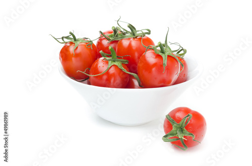 cherry tomatoes in a white bowl isolated