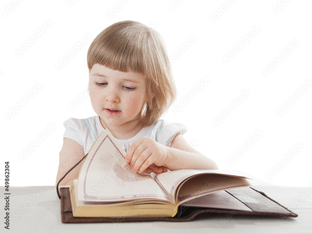 Pretty little girl reading an interesting book; white background Pretty little girl reading an interesting book; white background