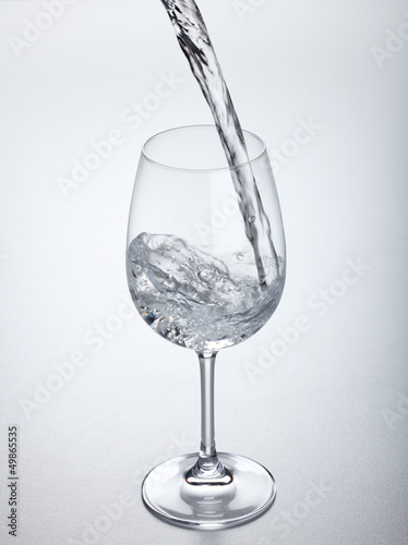 Water flowing into glass