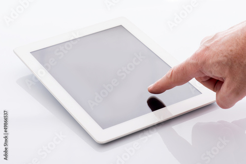 pointing finger on tablet pc photo