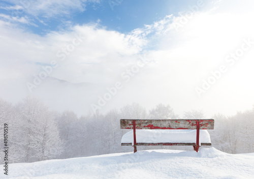 bench in front of winter landscape