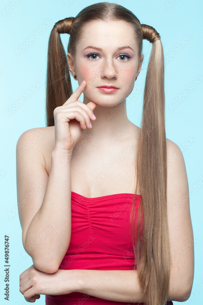 Freckled girl in red dress