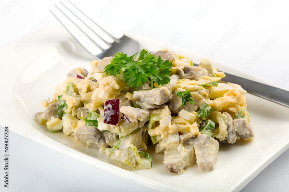 Eggs and mushrooms salad with leek and red onion on the plate Eggs and mushrooms salad with leek and red onion on the plate