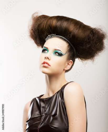 Fetish. Expressive Brunette - Frizzy Hairstyle. Creative Styling