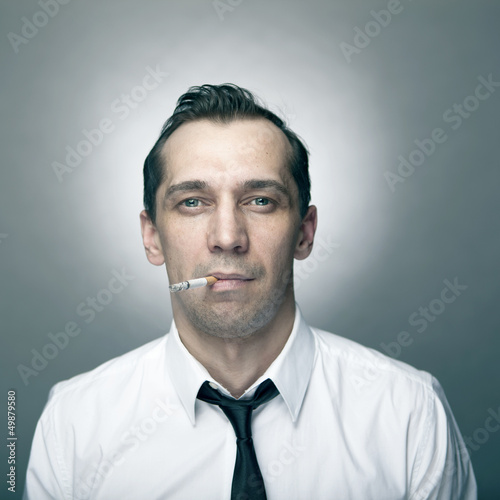 Portrait of smoking man at studio