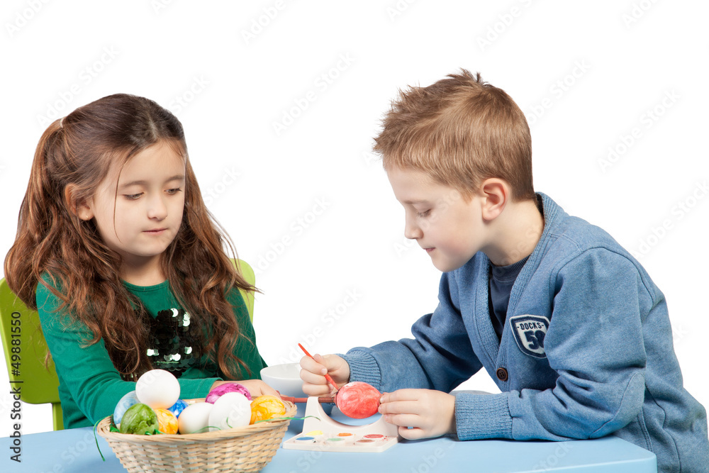 Brother and sister decorating Easter eggs Brother and sister decorating Easter eggs