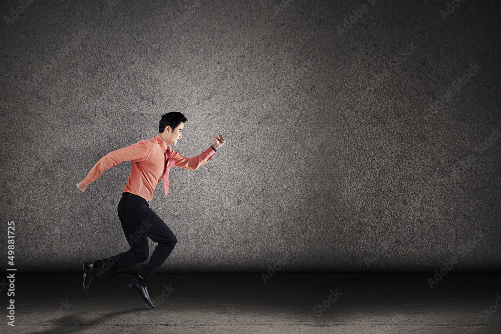 Businessman run for target on grey background
