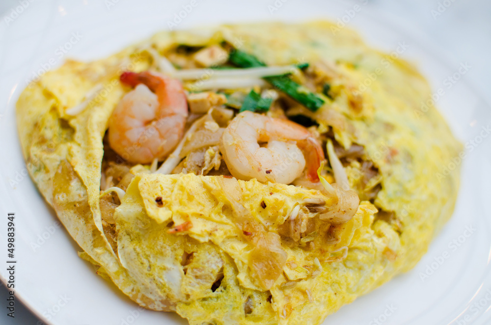 Fried noodle wrapped with eggs, Thai style food