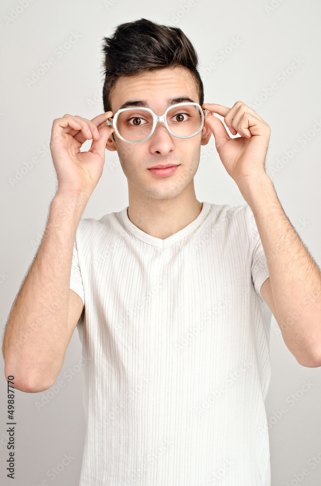 Surprised, amazed, wondering.Young man with funny glasses. Surprised, amazed, wondering.Young man with funny glasses.