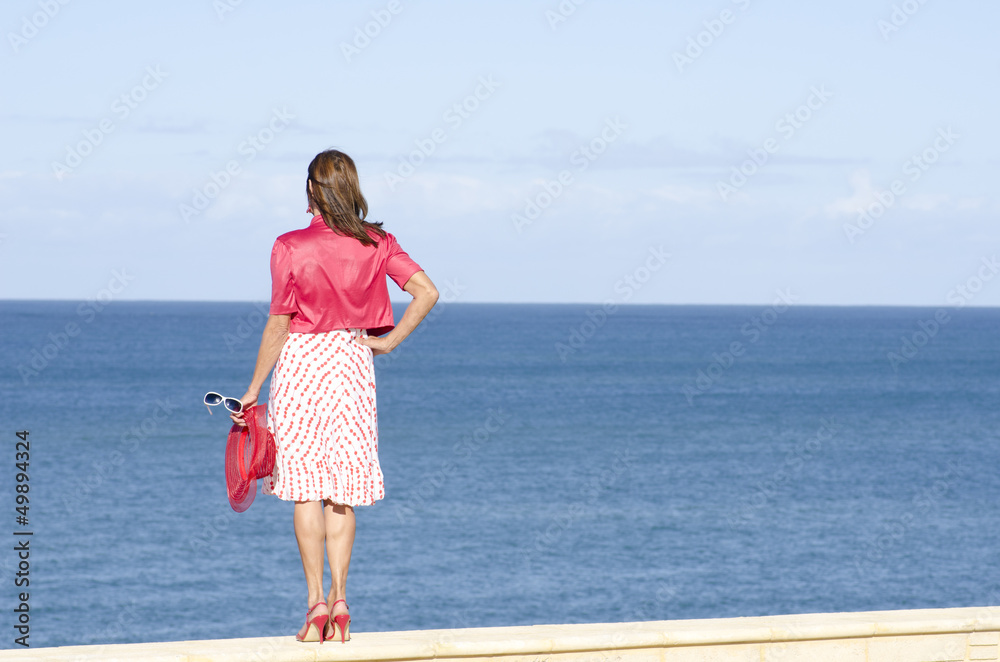 Sexy Mature woman isolated ocean background Sexy Mature woman isolated ocean background