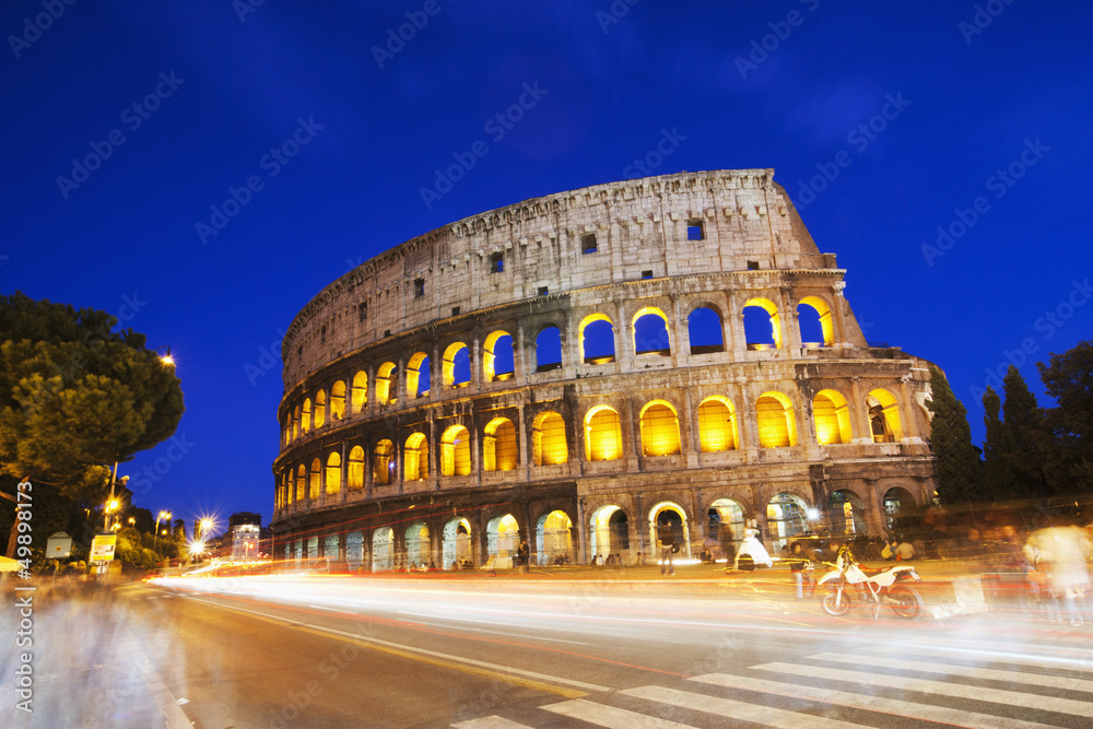 Night traffic in front of an Amphitheater, Colosseum, Italy