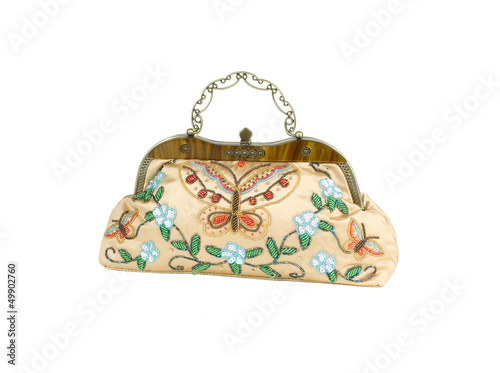 A luxury lady handbag decorated by colorful beads.