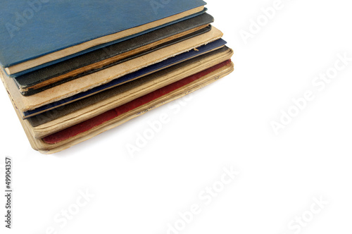 stack of old books on a white background