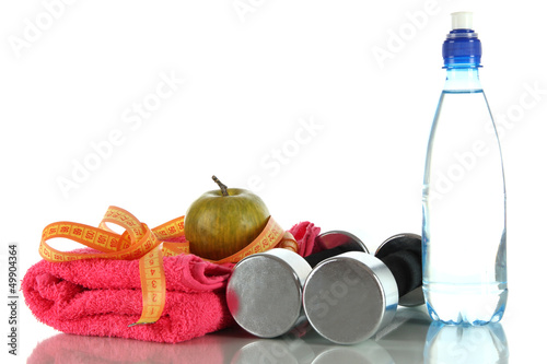 Composition of dumbbells,apple,towel,bottle of water and