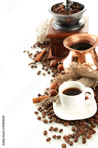Cup and pot of coffee and coffee beans, isolated on white