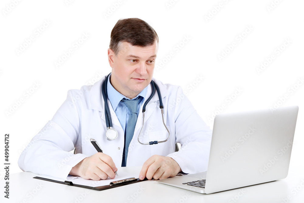 Medical doctor working at desk isolated on white Medical doctor working at desk isolated on white