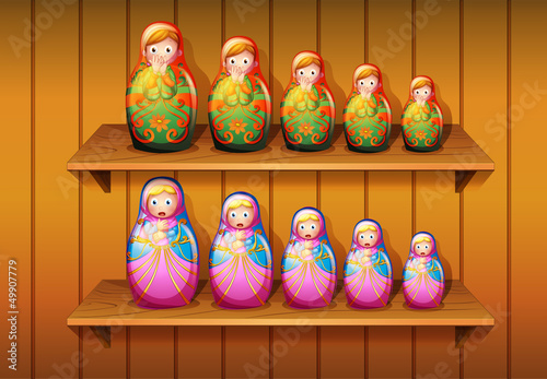 Dolls arranged in the wooden shelves