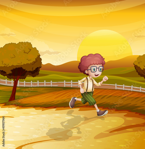 A sunset view with a boy running