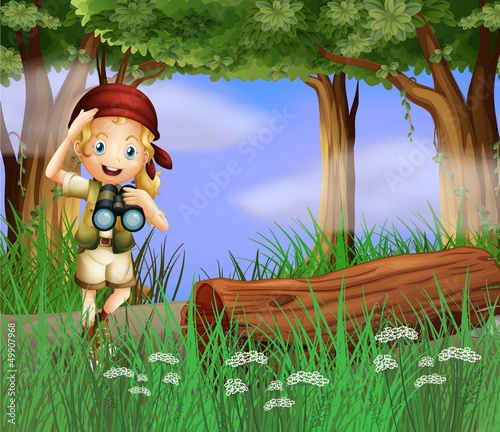 A girl with a telescope inside the forest