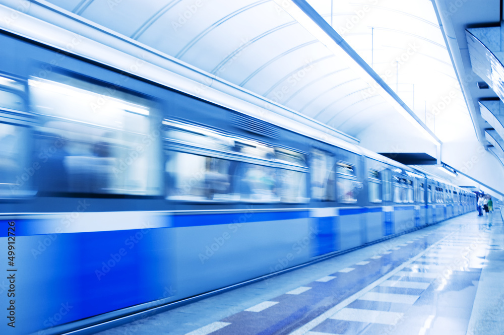 Moving train in subway station Moving train in subway station