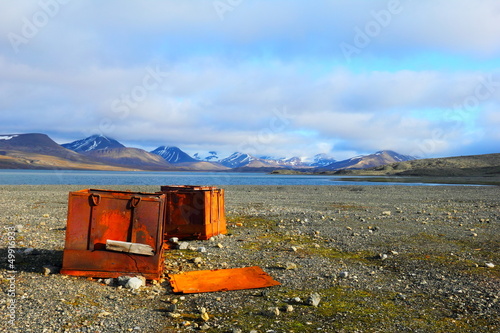 Iron boxes on the beach of Istfjorden, Spitsbergen (Svalbard) photo