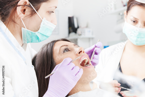 Woman having checkup at dental surgery