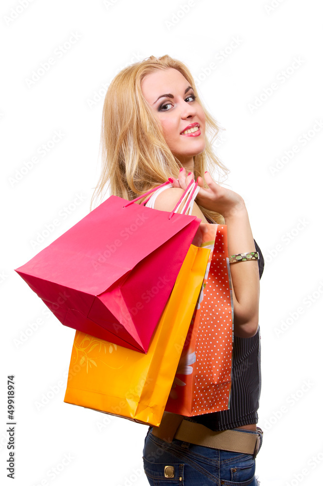 Young smiling woman with shopping bags isolated on white Young smiling woman with shopping bags isolated on white