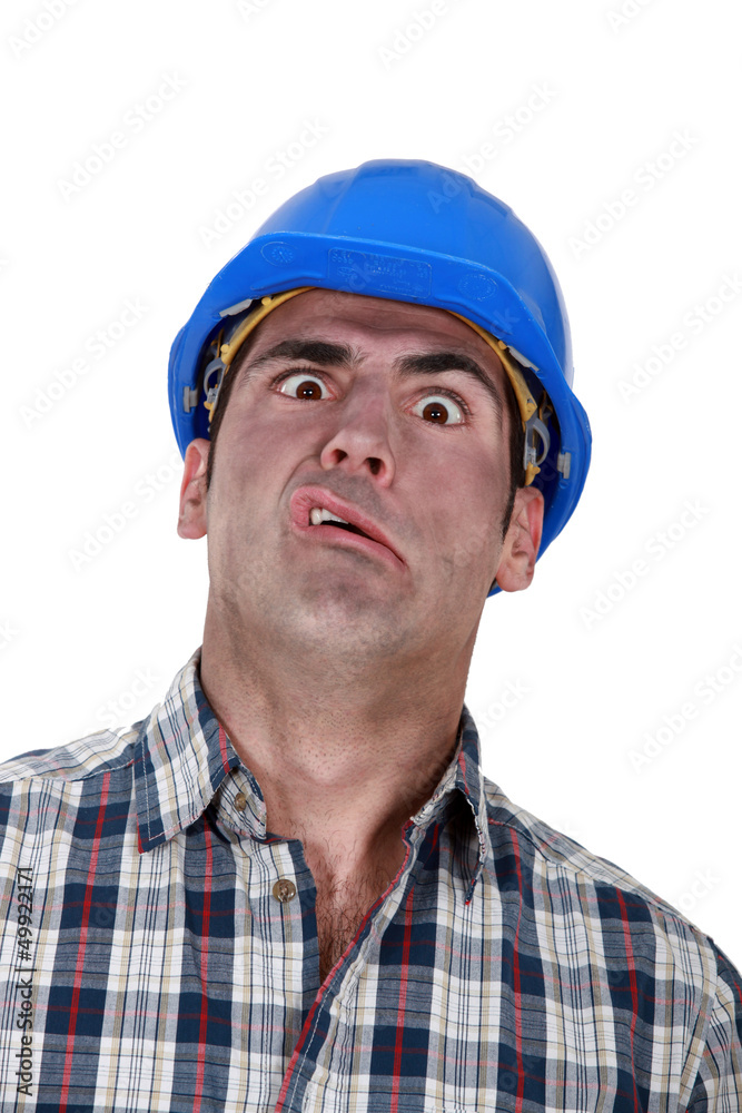 Portrait of grimacing worker Portrait of grimacing worker