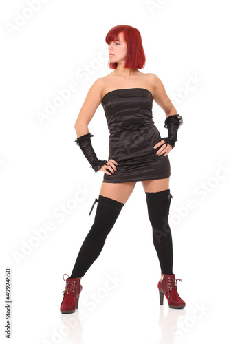 red-haired woman in black. Isolated on white