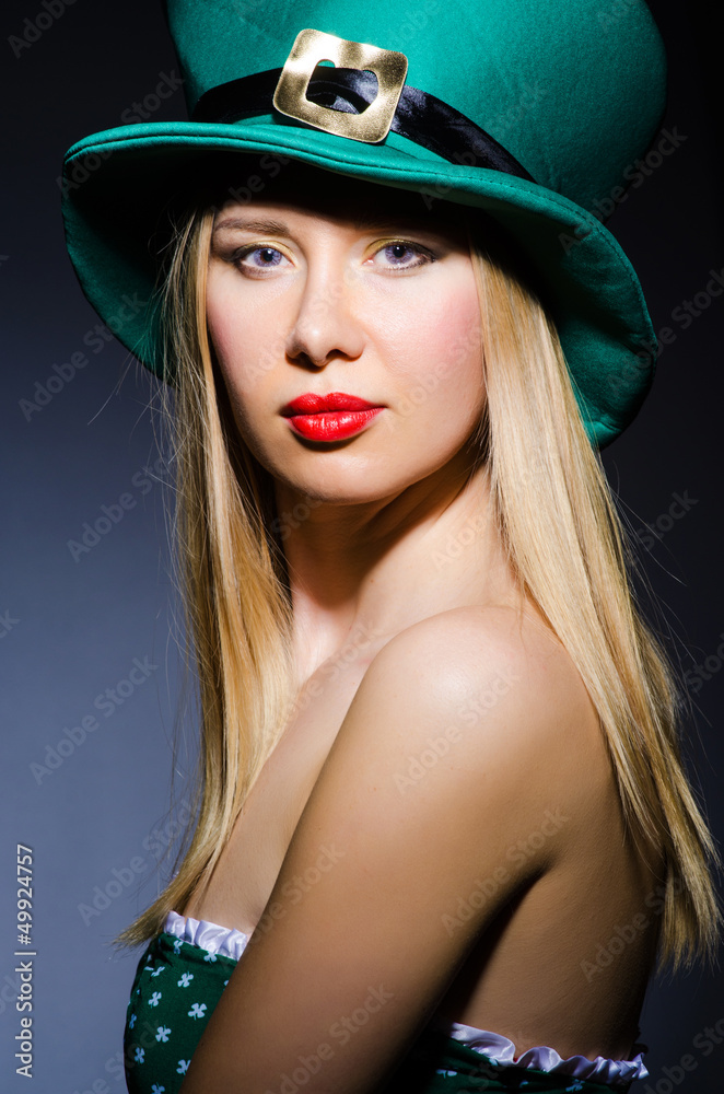 Young girl in saint patrick celebration concept Young girl in saint patrick celebration concept