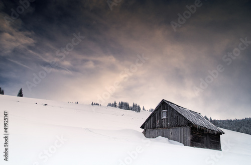 Winter scene with forbidden old house