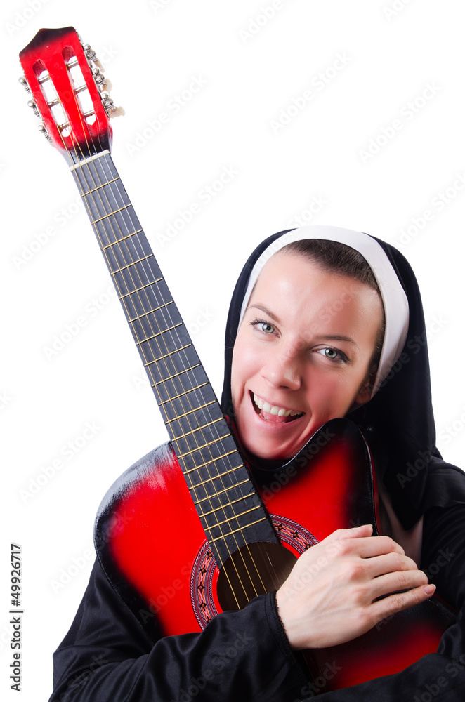 Fototapeta premium Nun playing guitar isolated on white