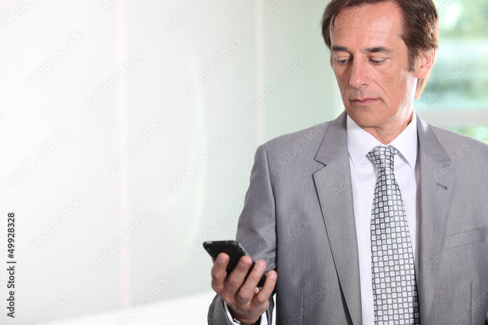 Businessman texting Businessman texting