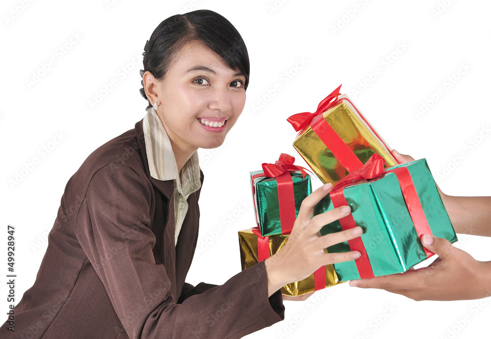 given a pile of gifts businesswoman smiling, isolated on white