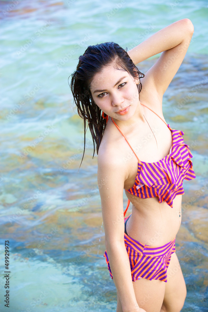 beautiful woman in bikini on the beach at summer day beautiful woman in bikini on the beach at summer day