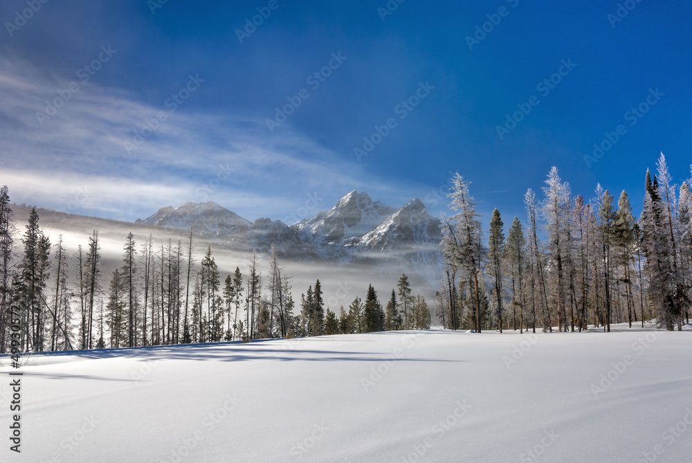 Frozen mountain lake covered with snow