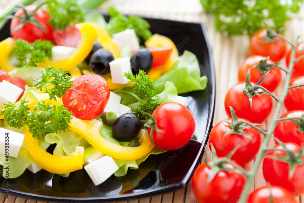 vegetable salad with cherry tomatoes and tomato branch