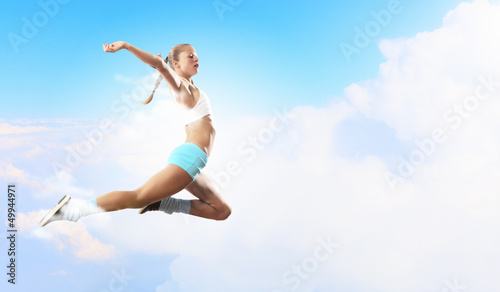 Image of sport woman jumping © Sergey Nivens