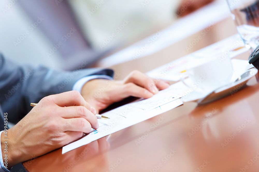 Hands of businessman writing Hands of businessman writing