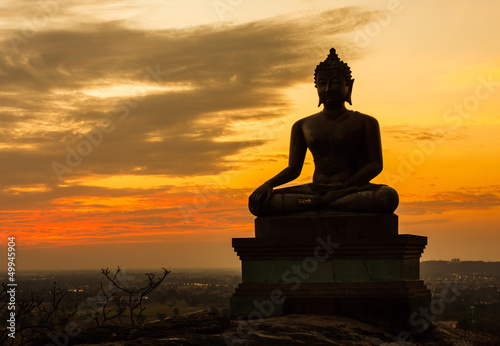 Buddha statue on sunset sky background at Saraburi, Thailand