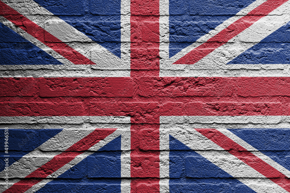 Fototapeta premium Brick wall with a painting of a flag