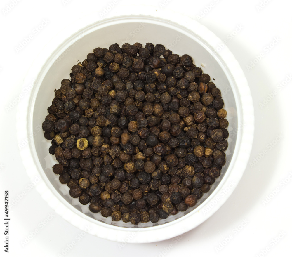 black pepper in a bowl on white background black pepper in a bowl on white background