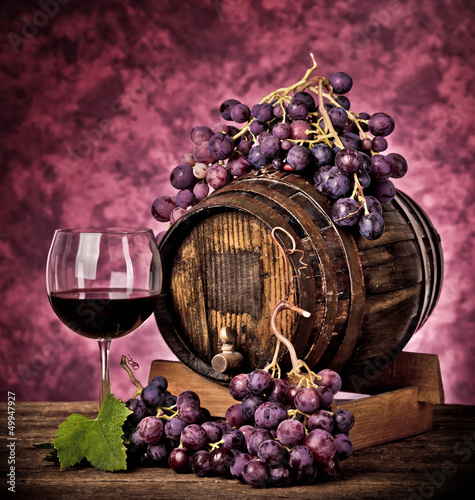 Fotografie Red wine bottle and wine glass