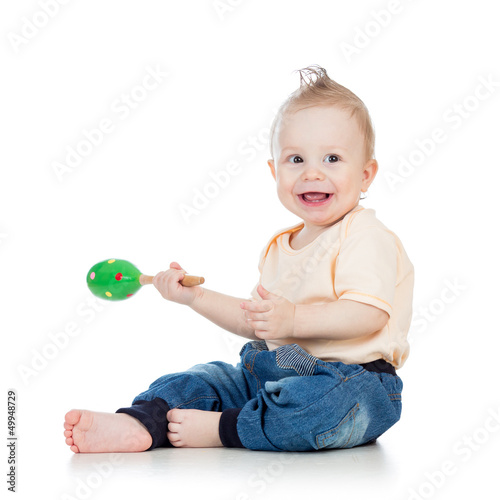 Baby  boy playing with musi...
