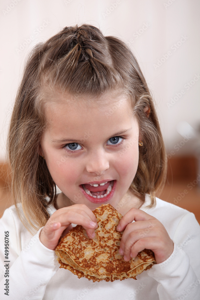 Little girl about to eat pumpkin Little girl about to eat pumpkin