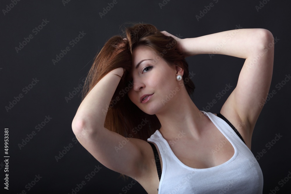 young woman playing with her hair