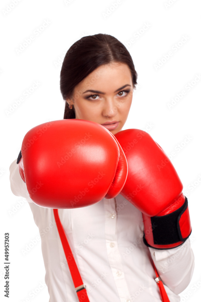 Portrait of business woman wearing boxing gloves Portrait of business woman wearing boxing gloves